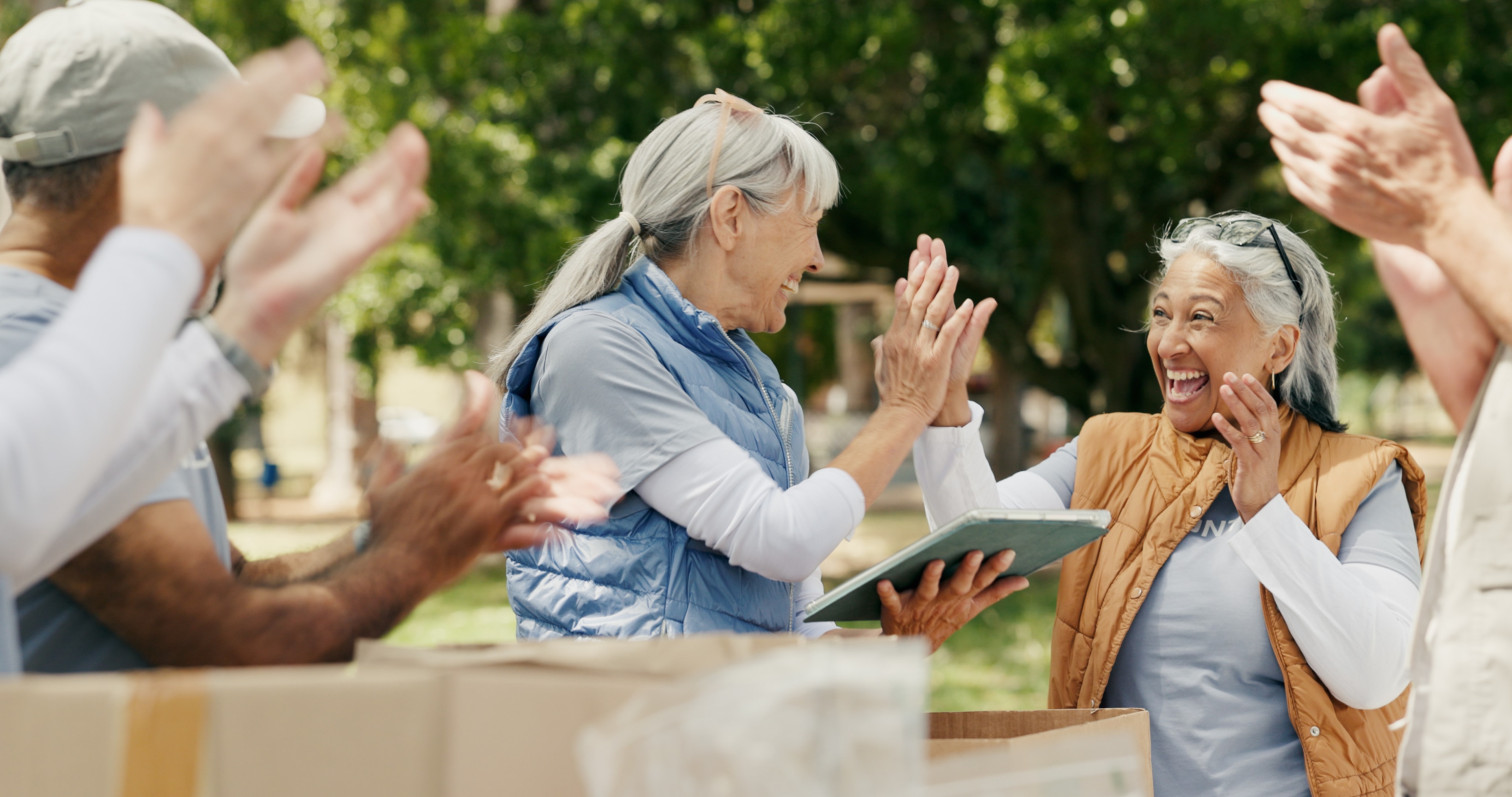 Older adults walking together outdoors in a park setting